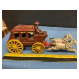 Vintage cast iron horse-drawn stagecoach