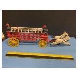 Vintage cast iron horse-drawn ladder fire truck