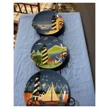 Plate hanger with lighthouse designs