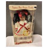 Porcelain doll in box
