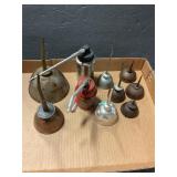 10 vintage oil cans,