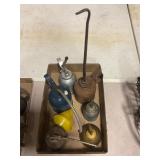 6 vintage oil cans and one funnel