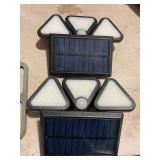 Two solar security lights