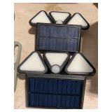 Four solar security lights outside