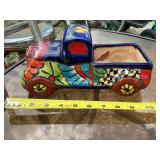 Glazed terra-cotta truck planter 1side has flaking
