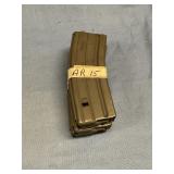 Three AR 15 magazines