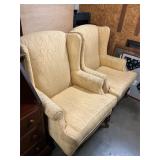 Two yellow matching accent chairs