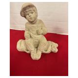 Austin Sculptures of boy sitting on golf bag