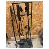 Metal fireplace tools on rack