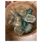 Basket of vintage glass line insulators