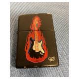 Zippo lighter with guitar scene