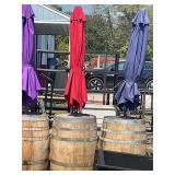 Whiskey barrel with red umbrella