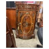 Antique style serpentine cabinet w/ damaged leg