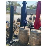 Whiskey barrel with blue umbrella