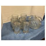 A glass pitcher, and 6 cups