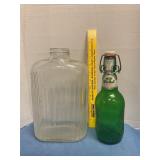 Clear glass water bottle &  grolsch beer bottle