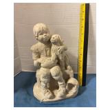 Vintage sculpture of boy with football & dog