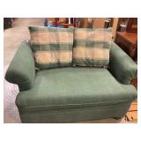 Overstuffed chair-and-a-half with accent pillows