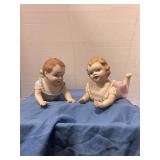 Antique porcelain "piano baby" figurines