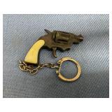 Vintage Sneaky Pete revolver cap gun keychain