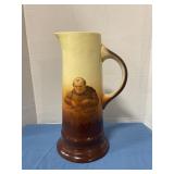 Antique Monk pottery pitcher