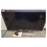 52 IN SHARP TV ON STAND W/ REMOTE