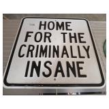 HOME CRIMINALLY INSANE METAL SIGN   18X18