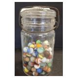 MARBLES IN VINTAGE ATLAS JAR