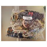 BAG OF ASSORTED COSTUME JEWELRY