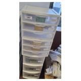 STACK OF STORAGE BINS, FABRIC SAMPLES