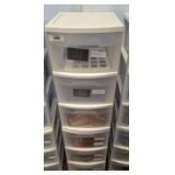 STACK OF STORAGE BINS, FABRIC SAMPLES