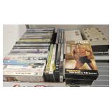 ASSORTED DVDS AND EXERCISE VHS