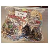 BAG OF ASSORTED COSTUME JEWELRY
