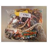 BAG OF ASSORTED COSTUME JEWELRY