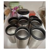 GROU[P OF CUPS AND INSULATORS FOR BOTTLES