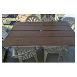 PATIO TABLE AND 6 PLASTIC CHAIRS