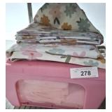 GROUP OF LINENS IN PLASTIC STORAGE BIN
