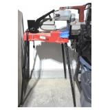 MILWAKEE PORTABLE BAND SAW ON PIPE STAND