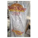 GROUP OF CINDY CROWFORD LINING LOCATED BY CLOTHES