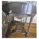 CARVED TOP ANTIQUE SPOOL LEG TABLE