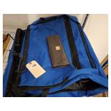 HAND BAG AND GARMENT BACK LOCATED ON CLOTHES RACK