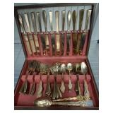 GOLD TONE FLAT WARE IN SILVER CHEST