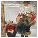 GROUP OF SANTA  AND MRS DECOR BROOM