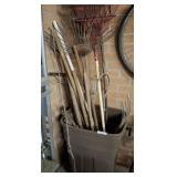 TRASH CAN OF YARD TOOLS