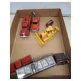 TRAY OF ASSORTED CAST TOY TRUCKS AND BANK