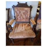 UPHOLSTERED ARMCHAIR ON CASTERS