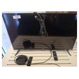 32 IN ONN ROKU TV ON STAND W/ REMOTE,