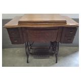 ANTIQUE CHAIN DRIVEN SEWING MACHINE CABINET AND MA