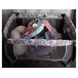 BABY TREND PACK N PLAY W/ ASSORTED BABY ITEMS/TOYS