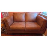 Brown Two-Seater Leather Sofa with Cushioned Arms
